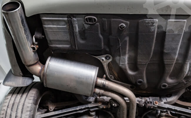 Why can a hole appear in the muffler?